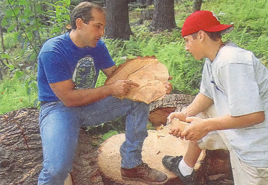 Dan and his son Jordan go over the fine points of firewood.